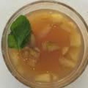 Fruit punch with mint leaves in glass.