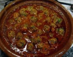 Meatballs in rich tomato sauce dish.