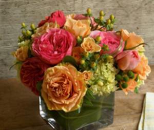 Colorful flower bouquet in a glass vase.