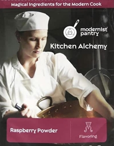 A woman in white shirt and hat holding a spoon.