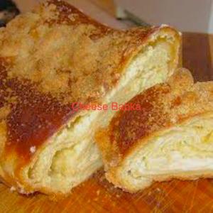 Golden cheese babka slices on cutting board