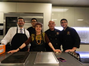 Group of chefs in a modern kitchen.