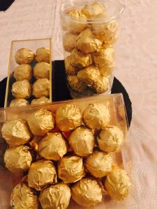 A tray of golden balls are on the table.