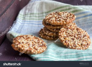 A pile of cookies sitting on top of a green towel.