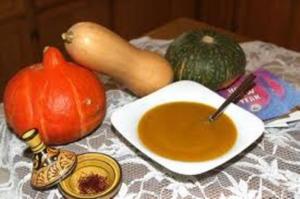 Pumpkin soup with squash and saffron displayed.
