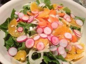 Colorful salad with radishes and oranges.