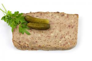 A piece of bread with pickles on top.