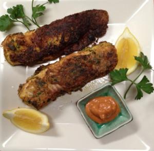 Fried fish with lemon and dipping sauce.