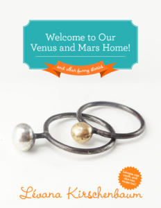 A pair of rings with a pearl on them.