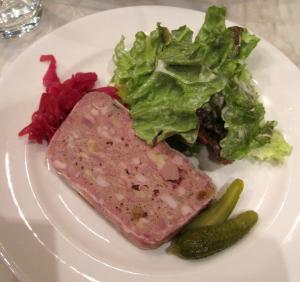 Pork terrine with lettuce, pickles, and slaw