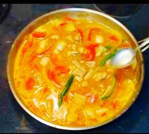 A bowl of food with some type of sauce.