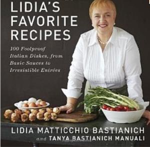 Cookbook cover with smiling chef and vegetables.