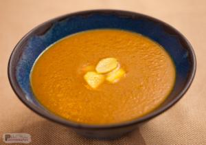 Bowl of creamy soup with croutons.