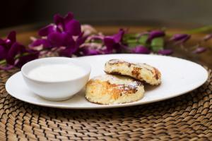 Golden cottage cheese pancakes with sour cream