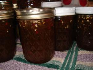 Jars of homemade preserves on a towel.