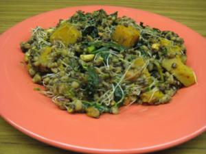 Mixed vegetable dish on pink plate.