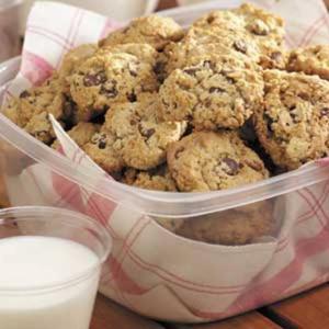 Chocolate chip cookies in a plastic container.