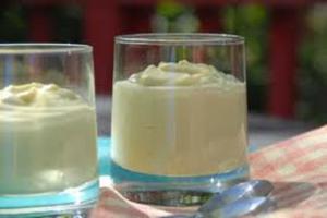 Two glasses of vanilla mousse with spoon