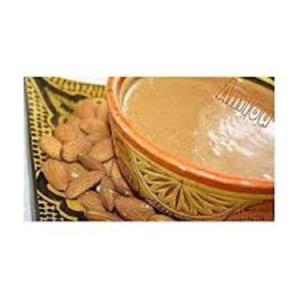 Bowl of almond dip with almonds.