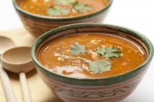 Bowls of soup with cilantro garnish.