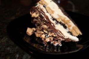 Slice of layered ice cream cake dessert.