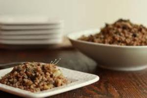 Plate and bowl of cooked grains.