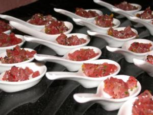 Spoons of diced tuna tartare on display.