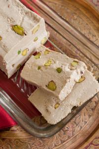 Sliced pistachio halvah in glass dish