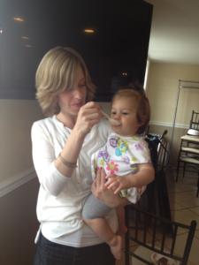 A woman holding a child in her arms.