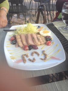 A plate of food with some type of writing on it