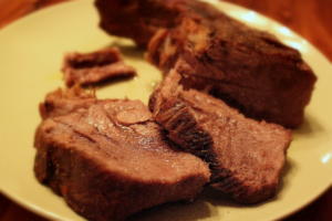 A plate of meat on top of a table.