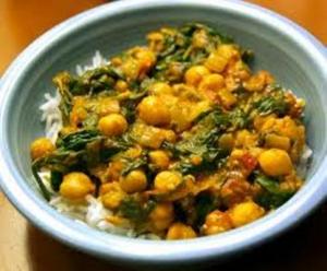 Golden chickpea and spinach curry over rice