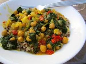 A white plate topped with rice and vegetables.