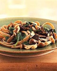 Sauteed mixed mushrooms with spinach on plate