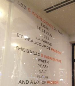 A white sign with some food on it