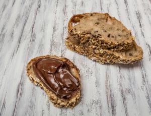 A close up of two pieces of food on top of a table.