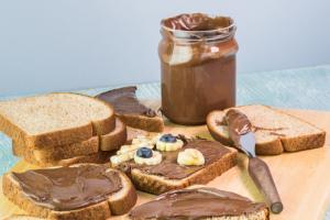 Bread slices with chocolate spread, banana and blueberries