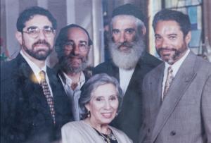 Group portrait of five smiling adults