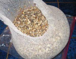 A bowl of nuts on top of a table.