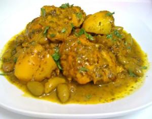 A plate of food with meat and vegetables.