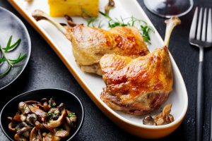 Crispy duck confit with sautéed mushrooms