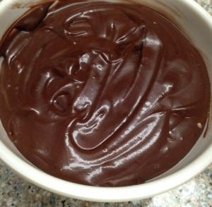 A bowl of chocolate pudding is shown.