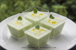 A group of four cups with different types of food in them.