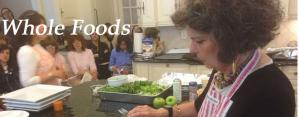 A woman is cutting up some green peppers