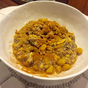 Bowl of oatmeal with golden raisins and cinnamon