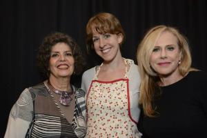Three women standing next to each other.