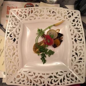 A white plate with some food on it