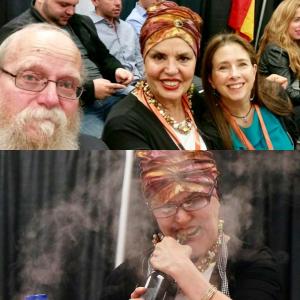 A group of people that are sitting in front of some kind of microphone.