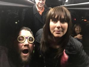 Two women and a man are on the subway.