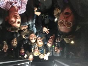 A group of people with faces in the middle.